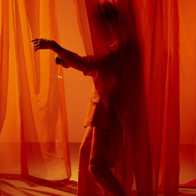 Abstract image of light filtering through sheer curtains.